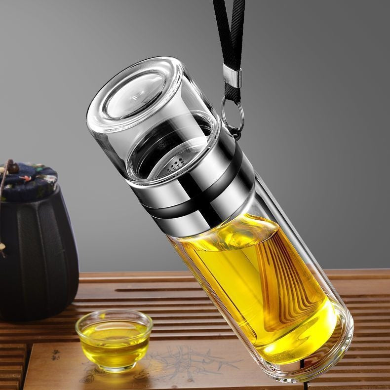 Silver tea bottle with tea, leaves in the top chamber