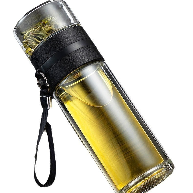 Black glass tea separator bottle with tea and leaves